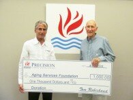 Dean Newman, Board President accepts $1,000